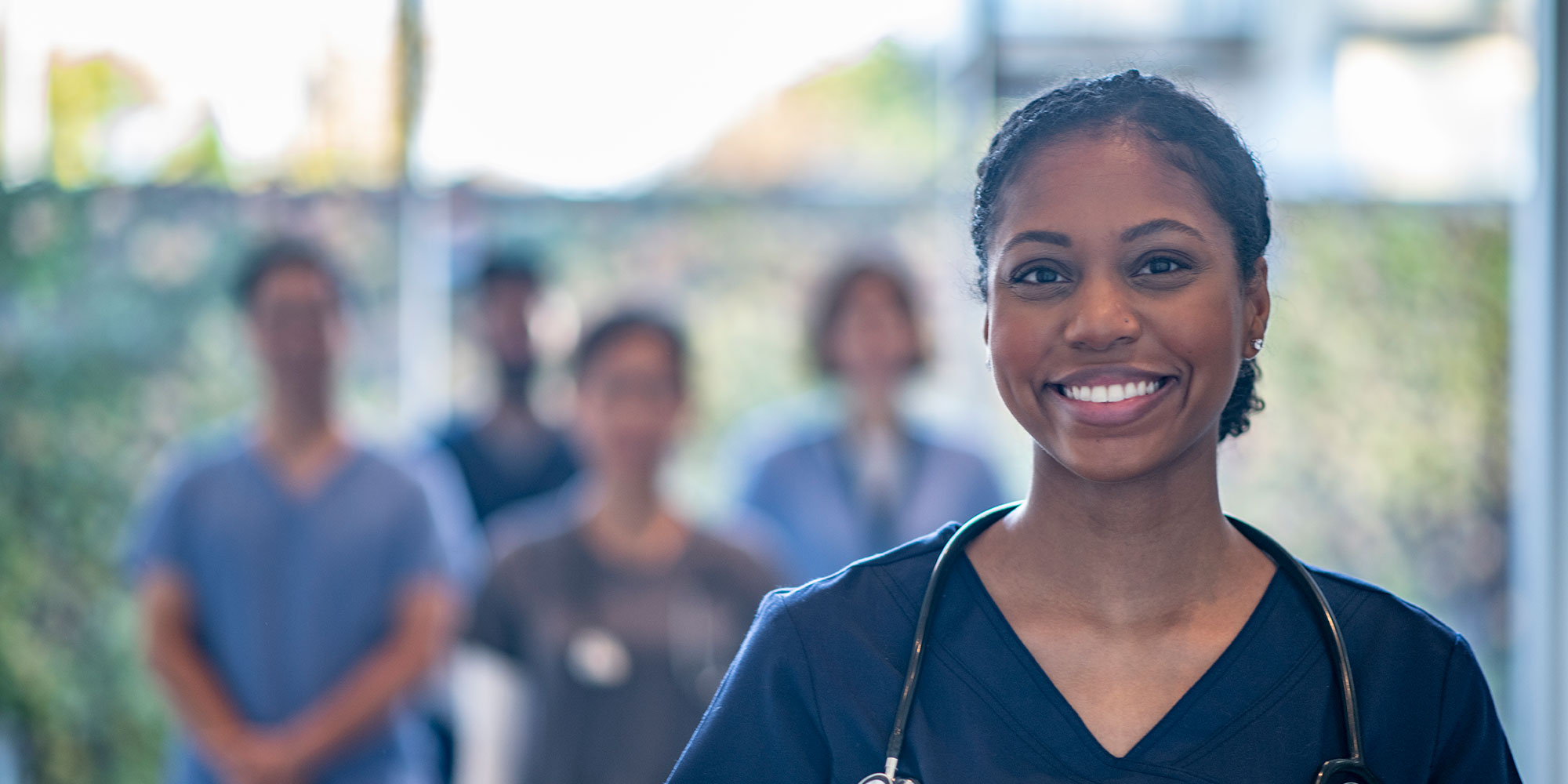 Medical residents stand together in a hallway