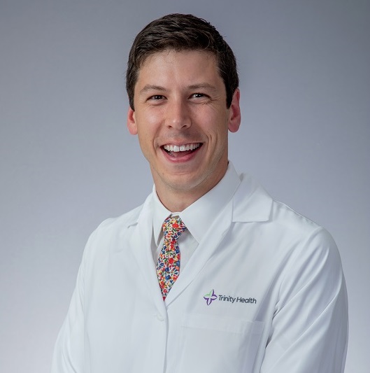 Dr. Doud posing in lab coat