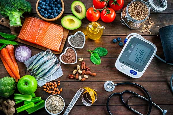 Assorted weight loss tools, such as a monitor, fresh fruit, etc.