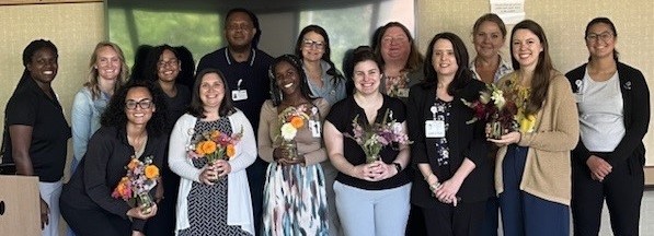Community health workers pose in a row