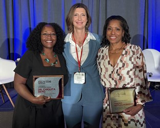 Dr. Berg, Shannon Striebich and Tawanna Nettles Robinson lined up holding awards