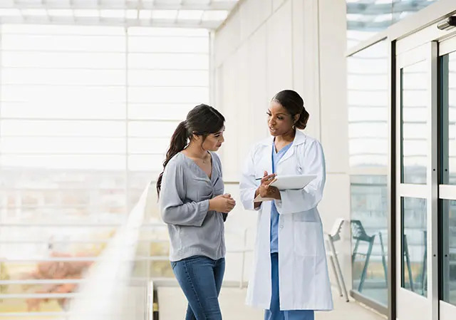 patient checking medical records with provider